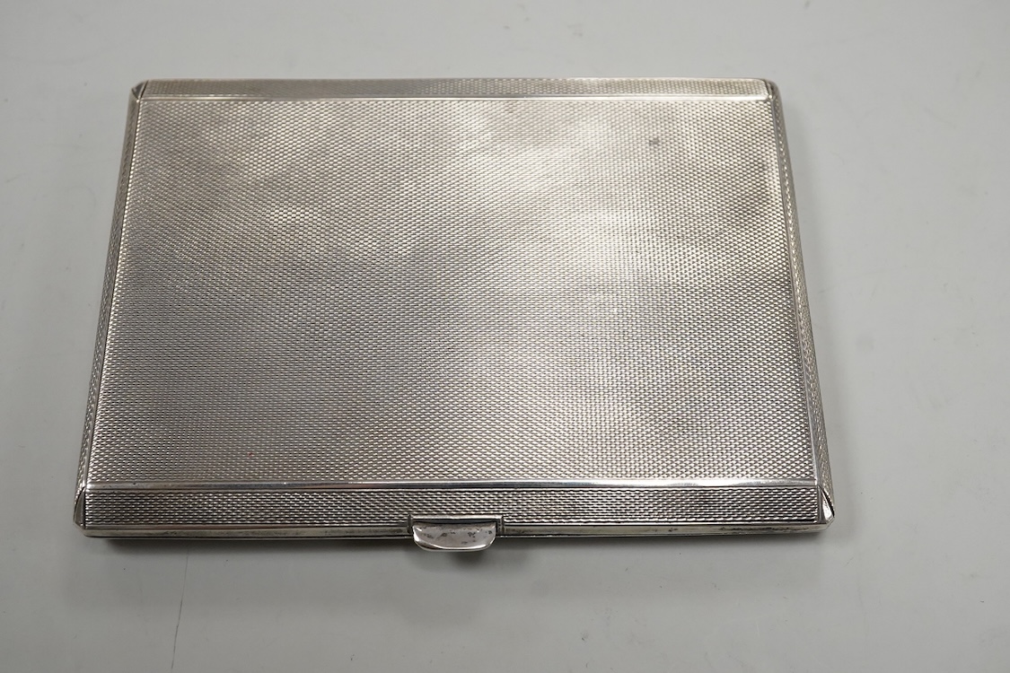 A George VI engine turned silver cigarette case, with interior engraved inscription relating to HRH Duke of Gloucester, Mappin & Webb, Birmingham, 1941, 11.4cm.